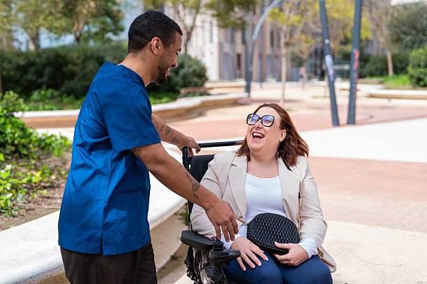 A participant and support worker on a video call with their coordinator